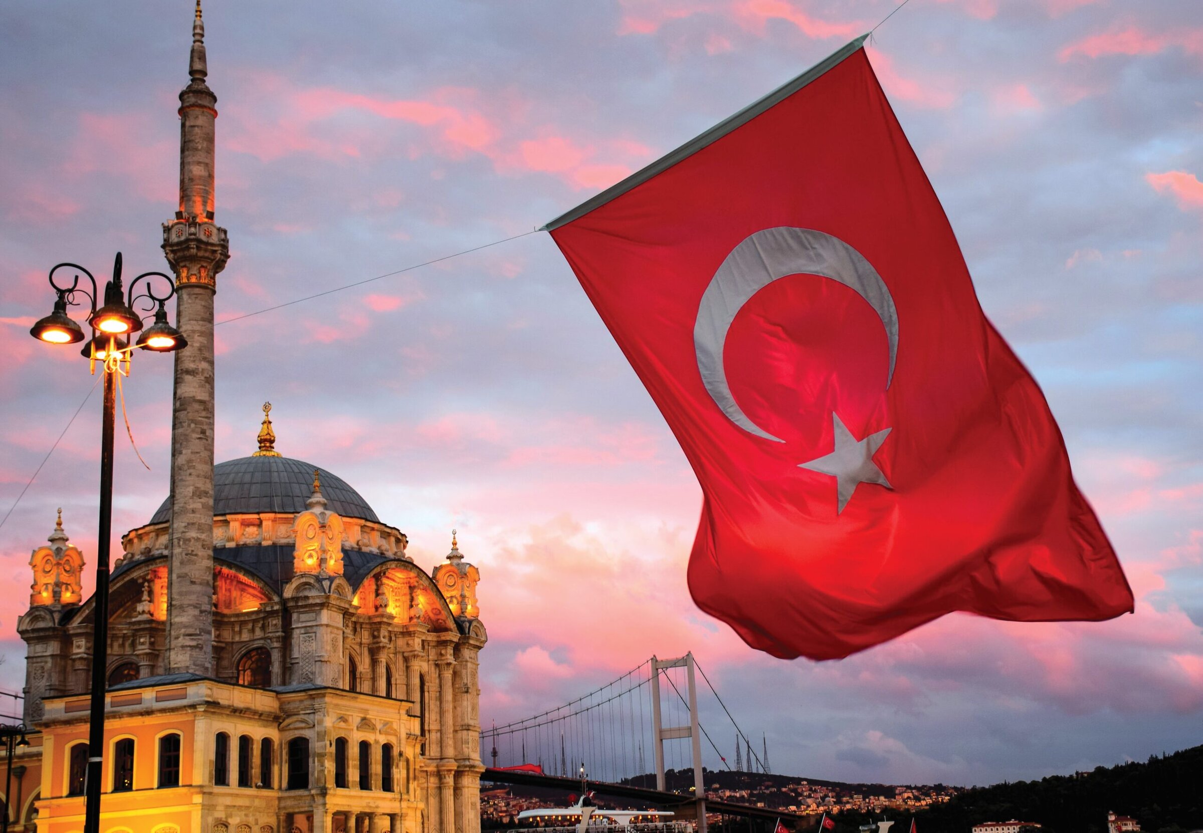 Istanbul with a sunset and Turkey flag