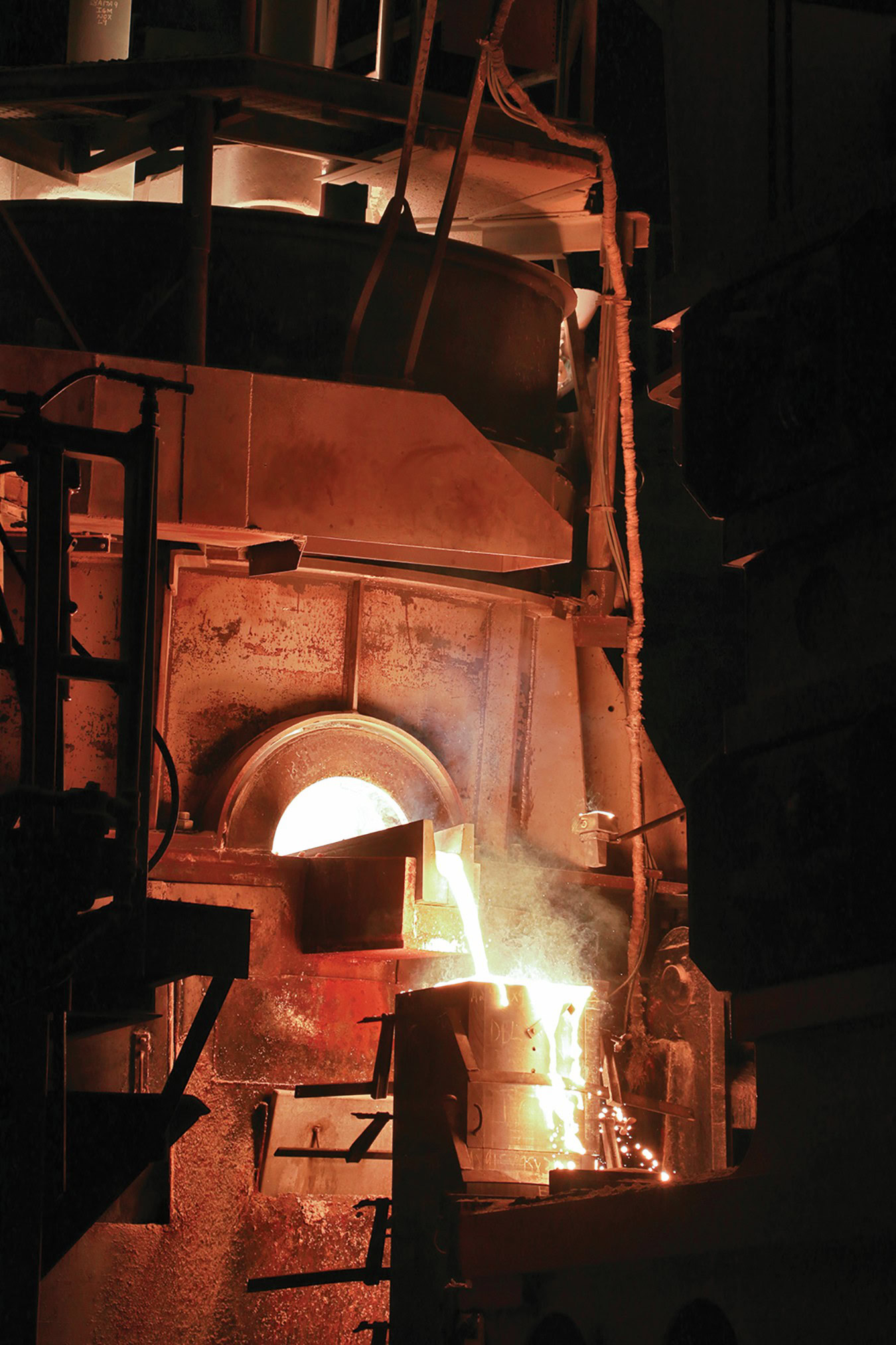 Molten glass pouring in a ceramics kiln for high-temperature firing.