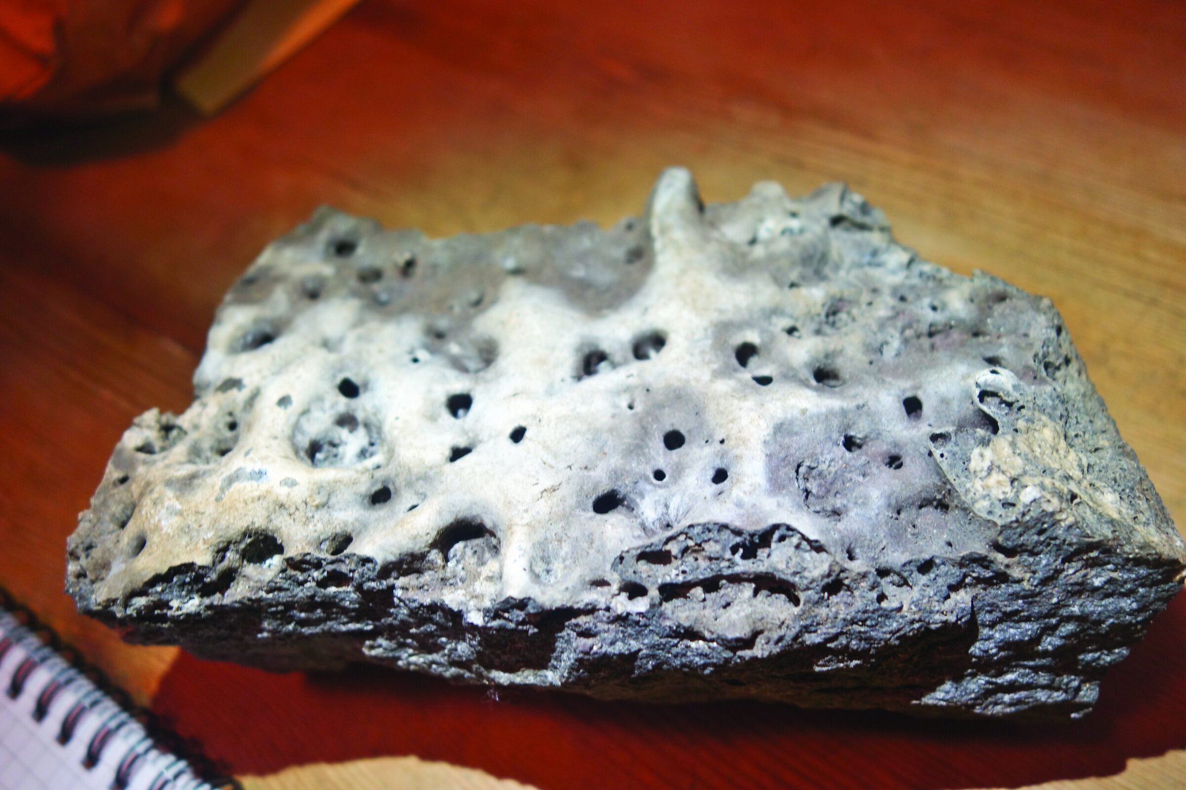Volcanic rock specimen for ceramic research and materials science.