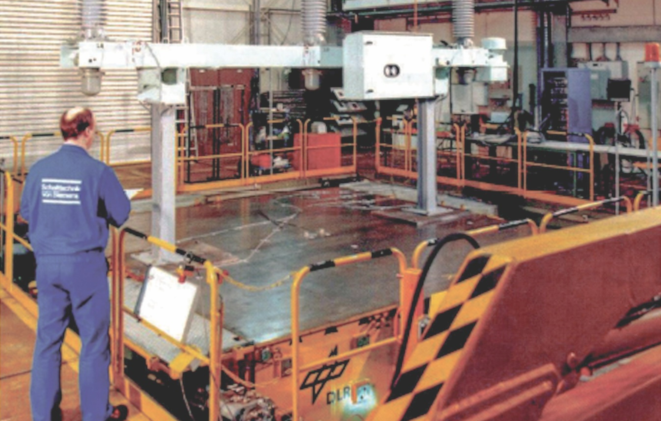 Cropped image of seismic test of porcelain insulators with a height of 4 m on an earthquake test rig, stressing the porcelain with high dynamic forces caused by predetermined dynamic vibrations.