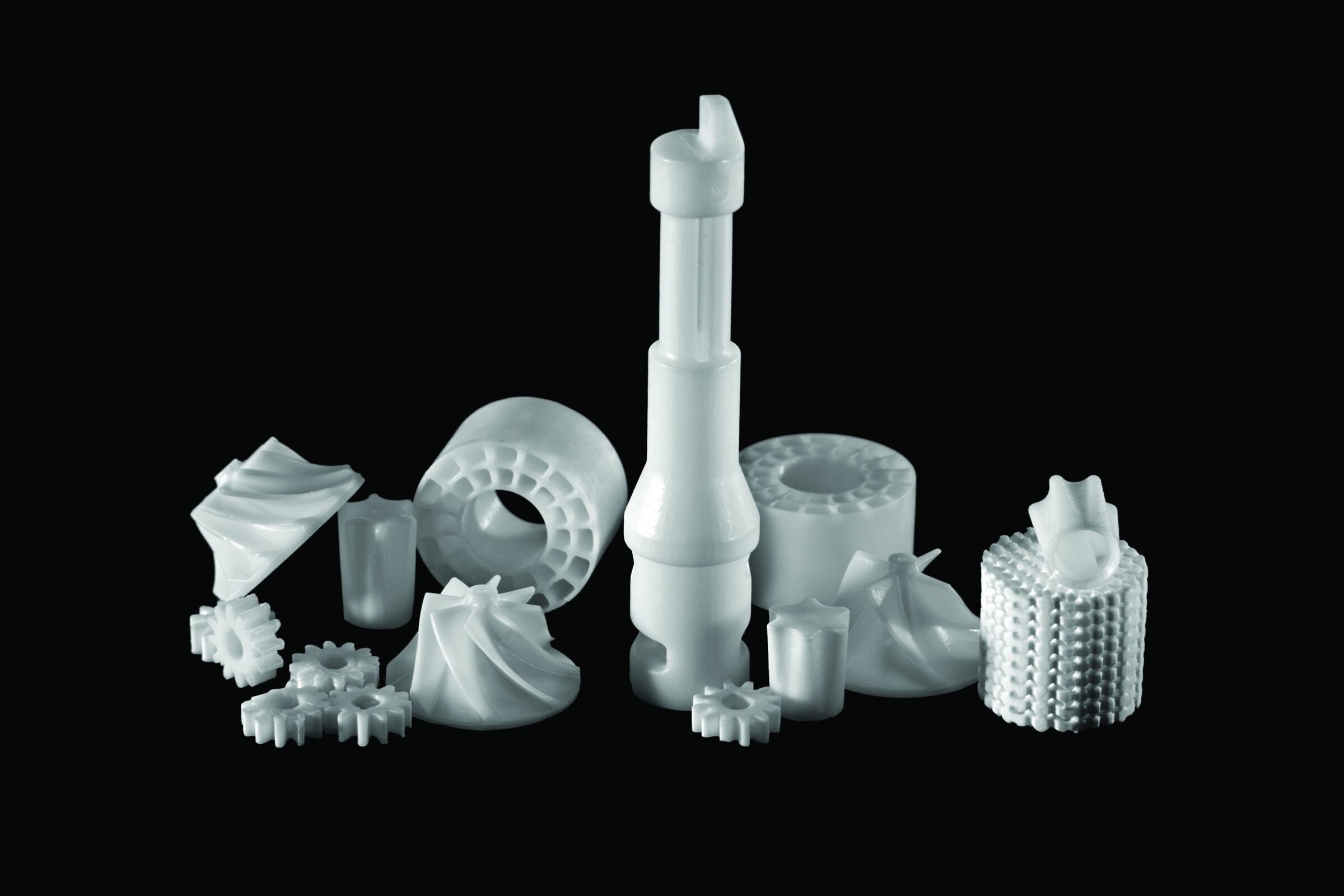 Alumina parts against a black backdrop.