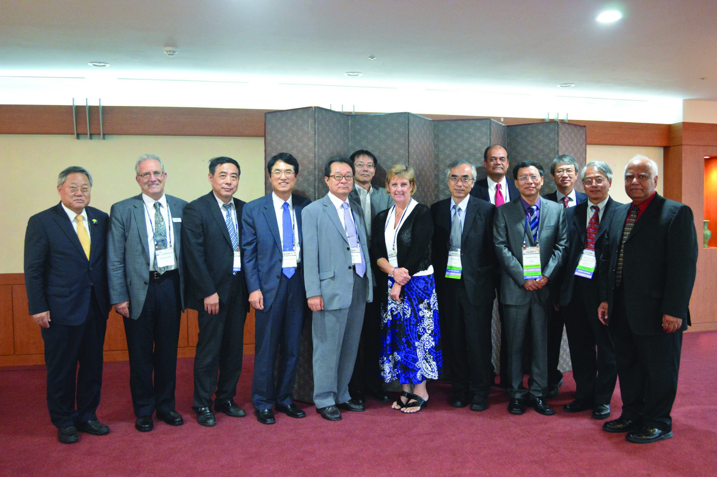 Group of professionals at the ACerS Bulletin conference, showcasing leadership in ceramics research and industry.