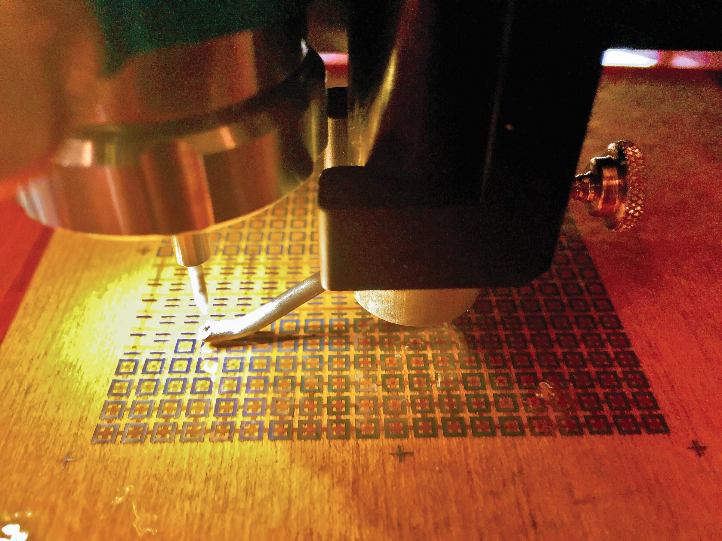Soldering ceramic surface with precision tools for ceramic artwork or manufacturing.