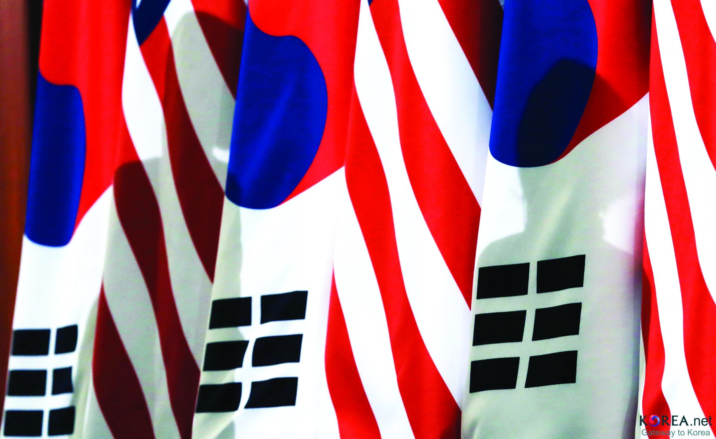 Flags of South Korea, vibrant colors, ceramic and ceramic art display, Ceramics Society event, ACerS Bulletin feature, Korean cultural ceramics, ceramic industry showcase.