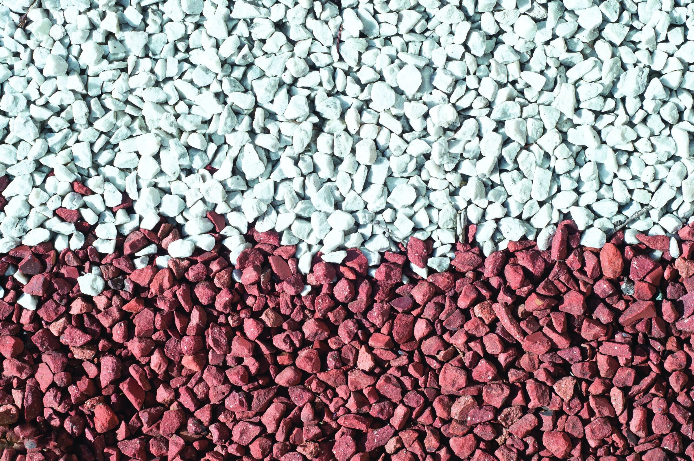 Colorful ceramic gravel with red and white stones for decorative garden and landscape use.