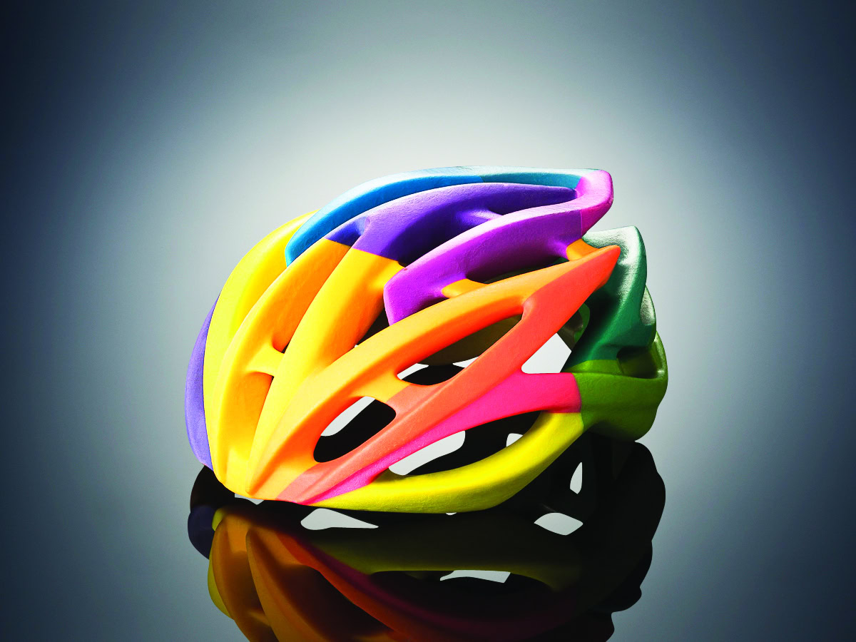 Colorful ceramic bicycle helmet sculpture for ceramic art and design enthusiasts.