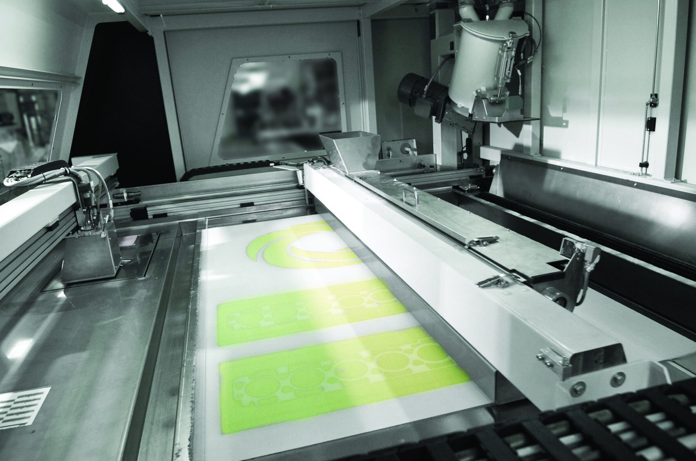 Precision ceramic parts being manufactured with industrial 3D printing technology in a ceramics production facility.