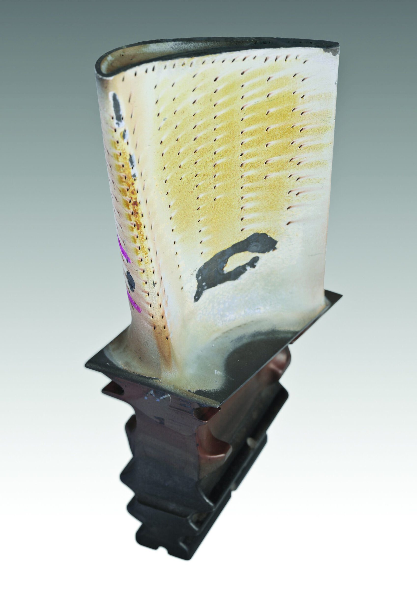 Thermal barrier coating damage on a turbine blade.