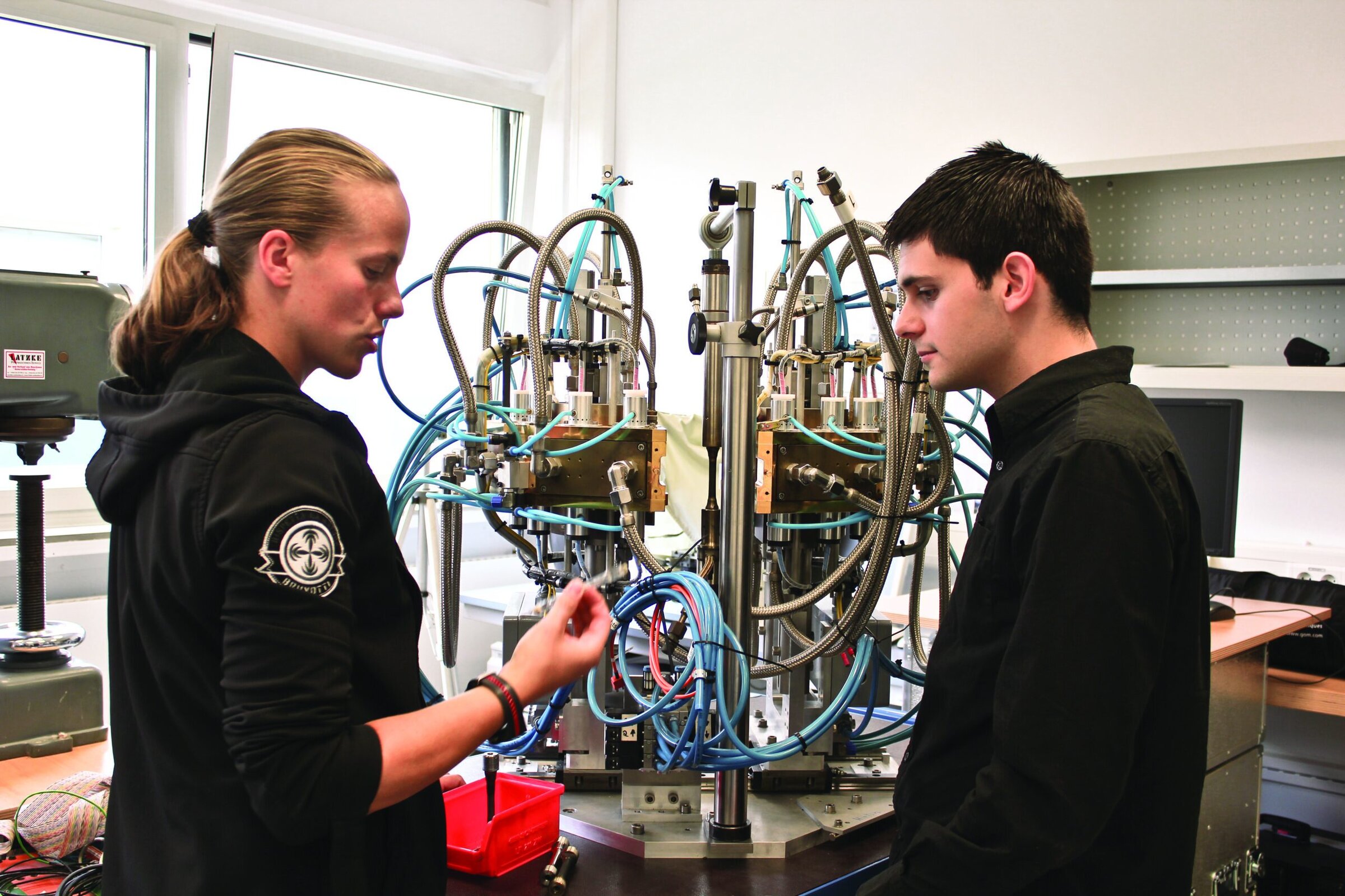 High-tech ceramic research laboratory with scientists working on advanced materials.