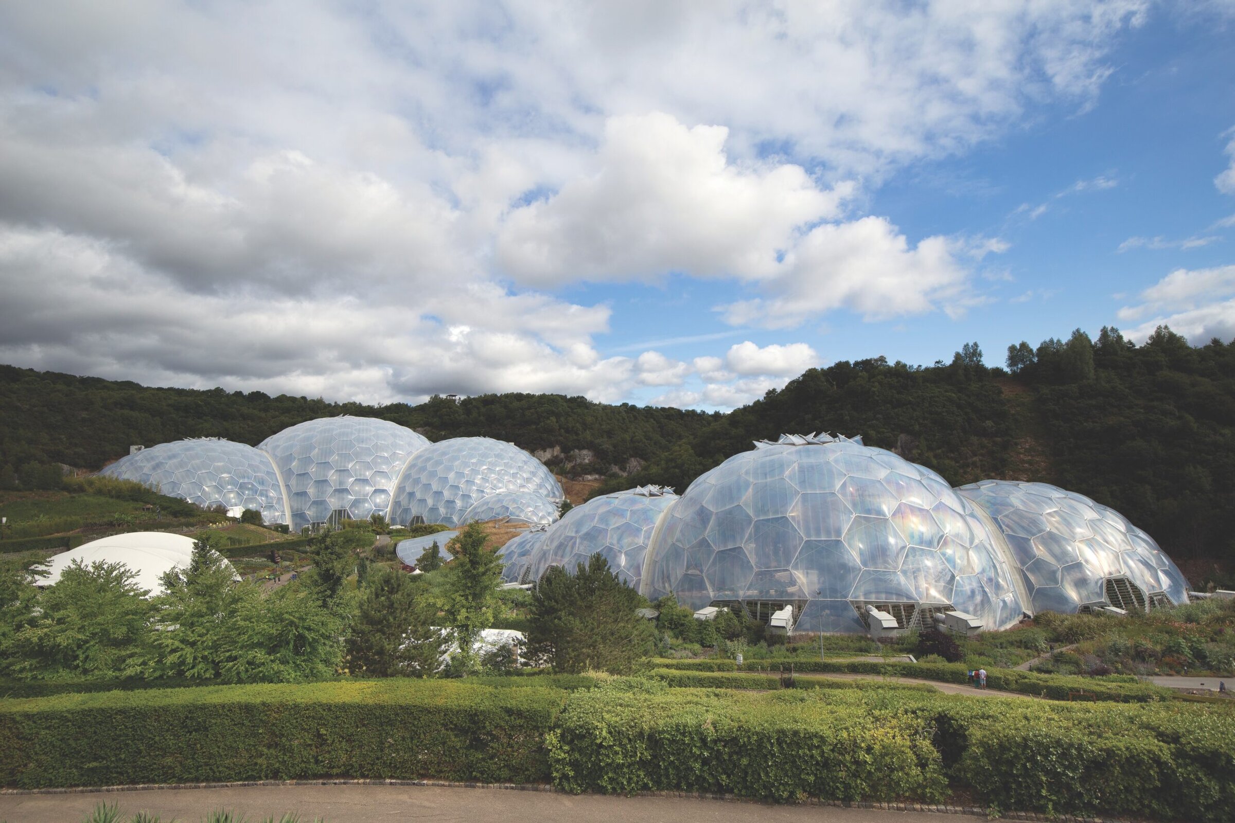 Modern geodesic domes at the Eden Project in Cornwall, showcasing innovative architectural ceramics and sustainable design.