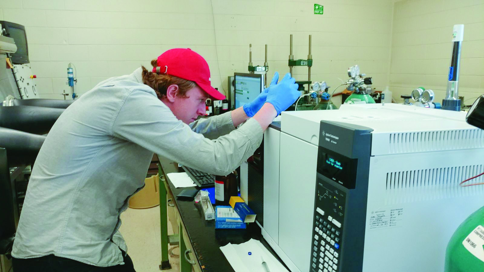 High-tech ceramics research laboratory with scientist using laboratory equipment for ceramic analysis.