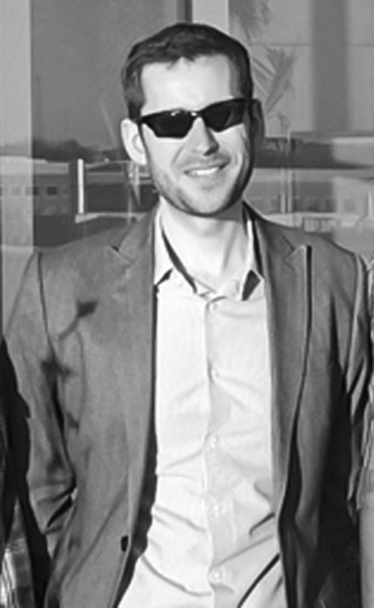 Men wearing sunglasses at ceramics industry event.