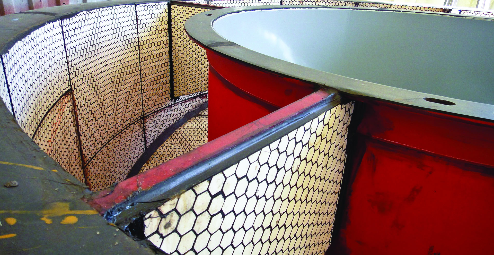 Fireclay refractory tank with hexagon tiles for ceramic kiln lining.