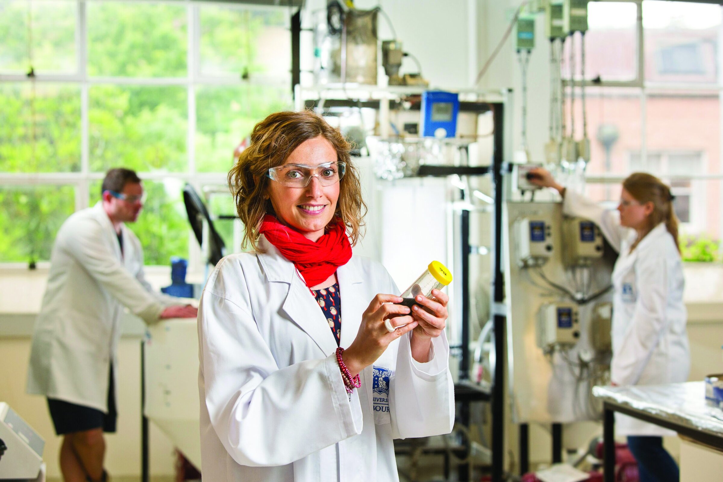 Scientists in a ceramics laboratory conducting research and testing materials for advanced ceramics applications.