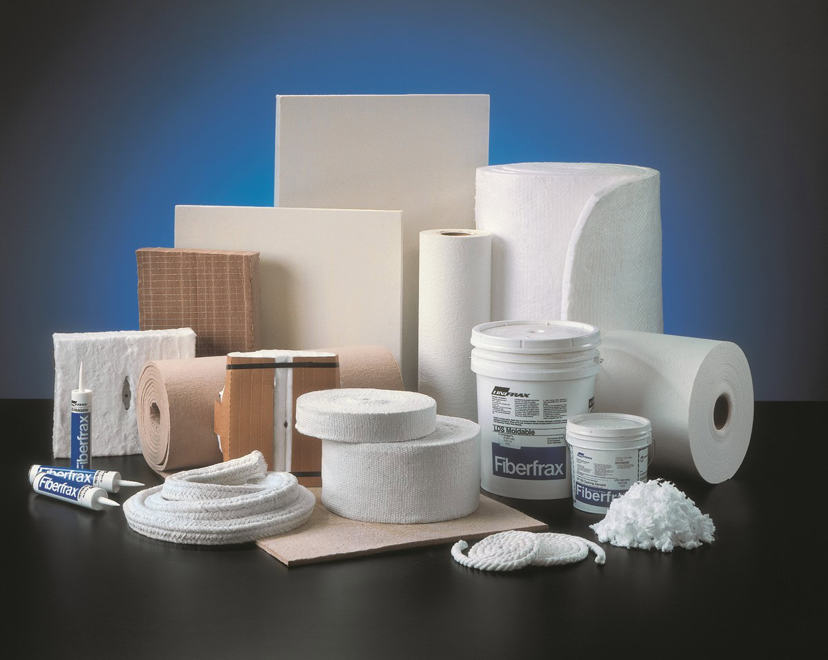 High-quality ceramic and insulation materials, including fiberglass insulation, ceramic tiles, and sealants displayed on a black surface.