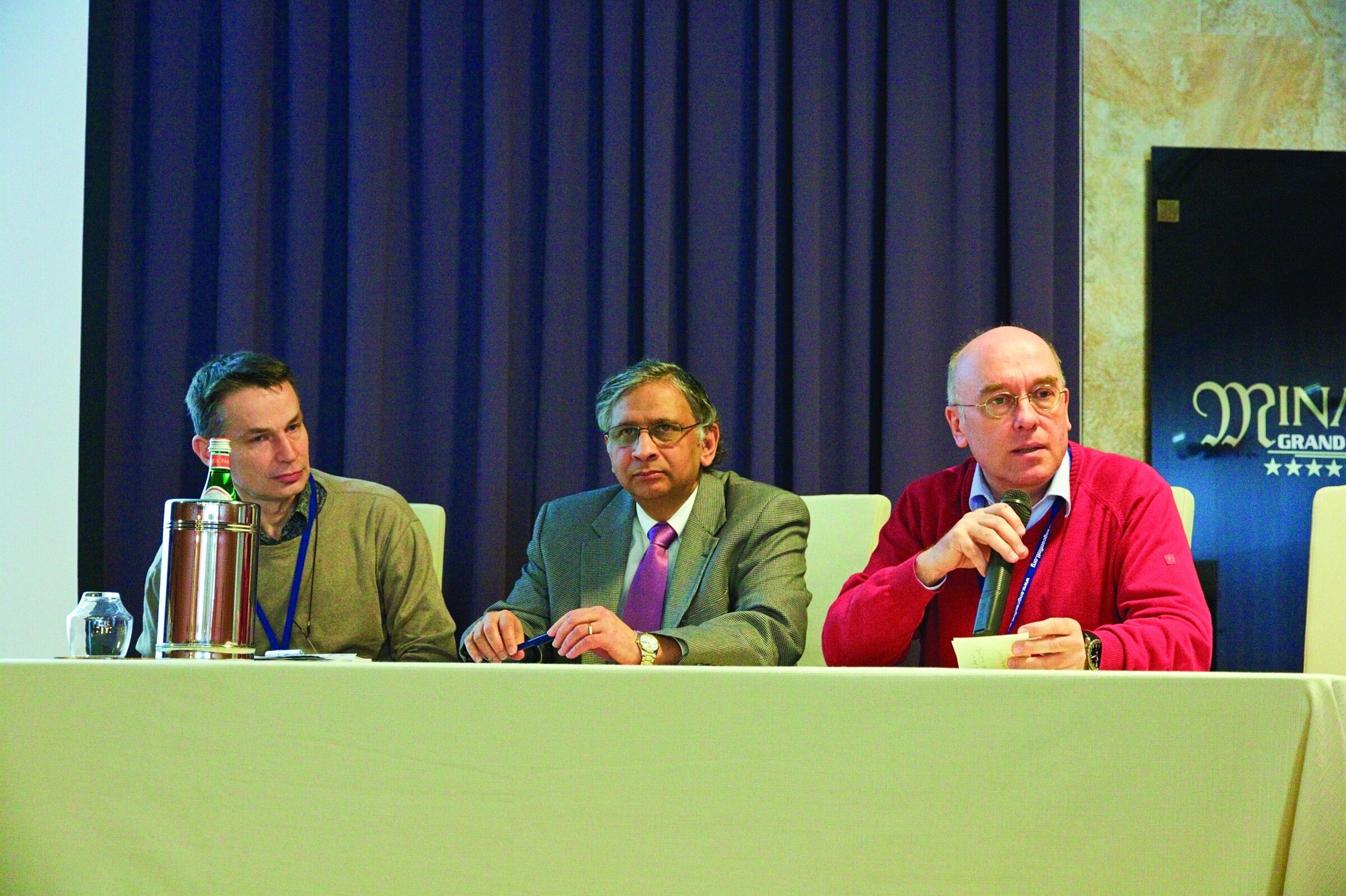Experienced panelists speaking at a professional Ceramic Society conference.