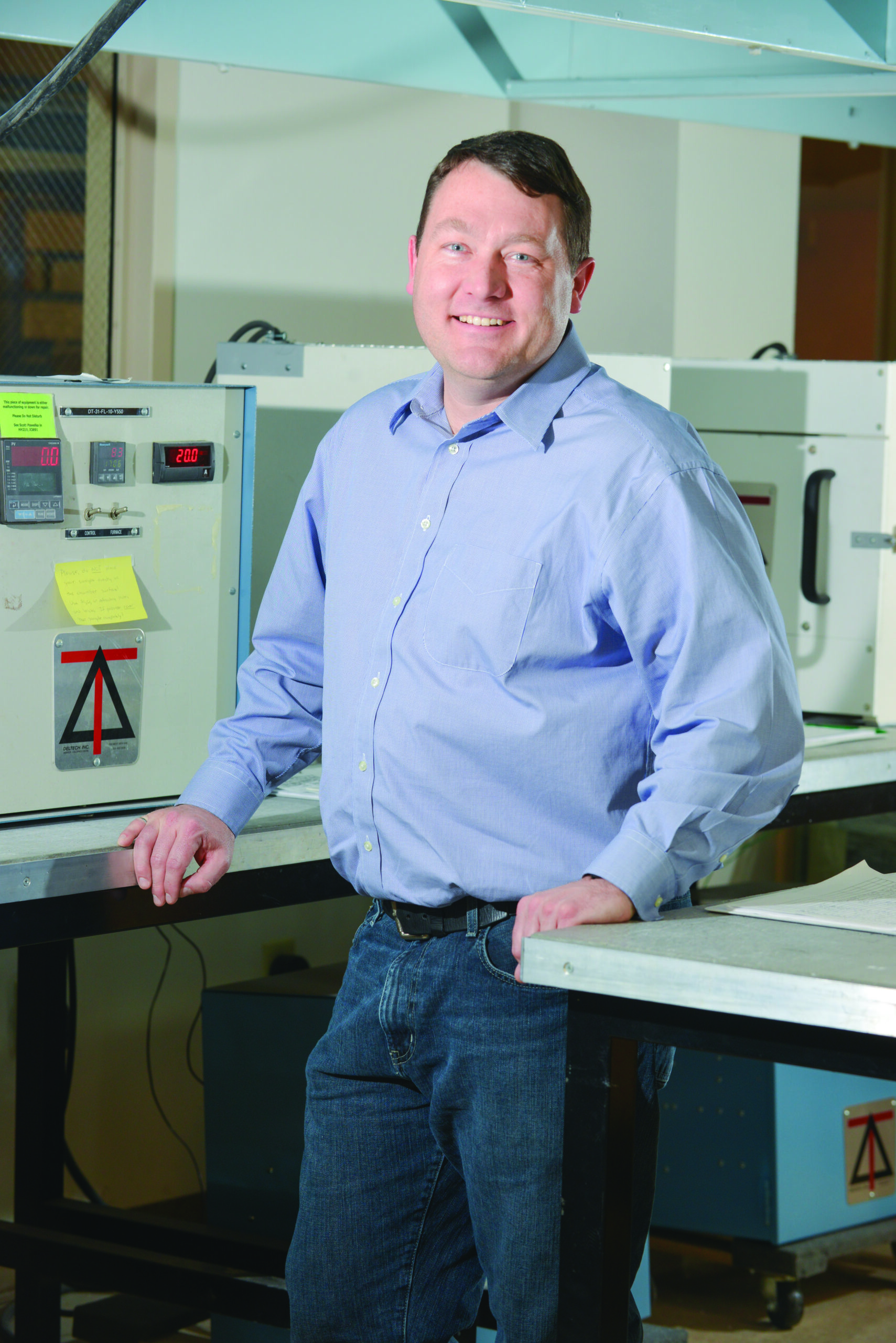 Man smiling in classroom.
