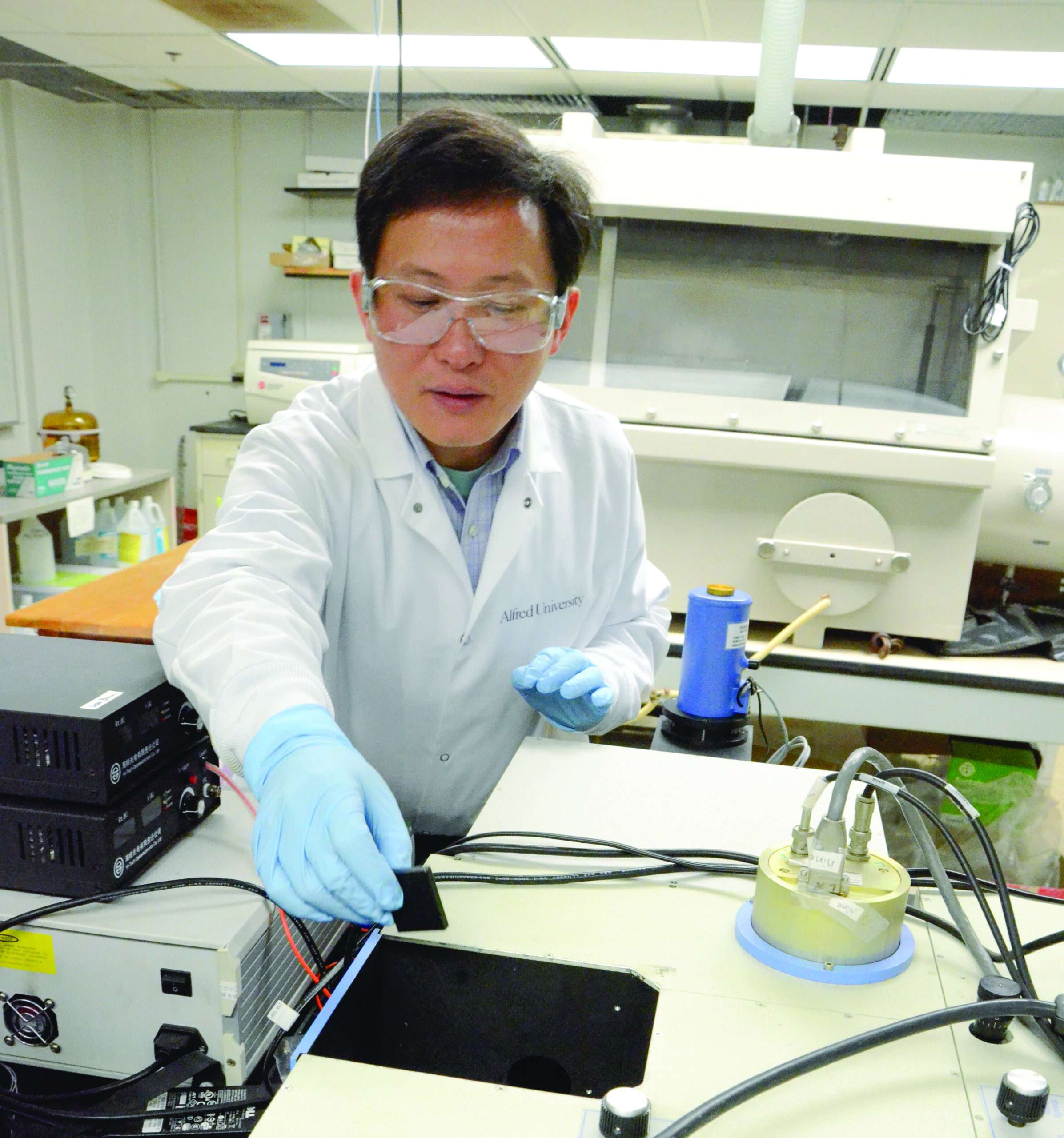 Man in lab coat in a lab.