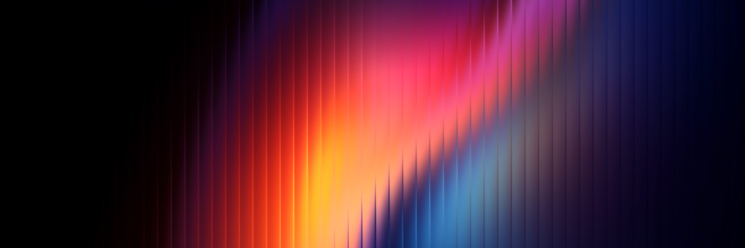 Vibrant abstract background with colorful vertical streaks in shades of pink, orange, blue, and purple.